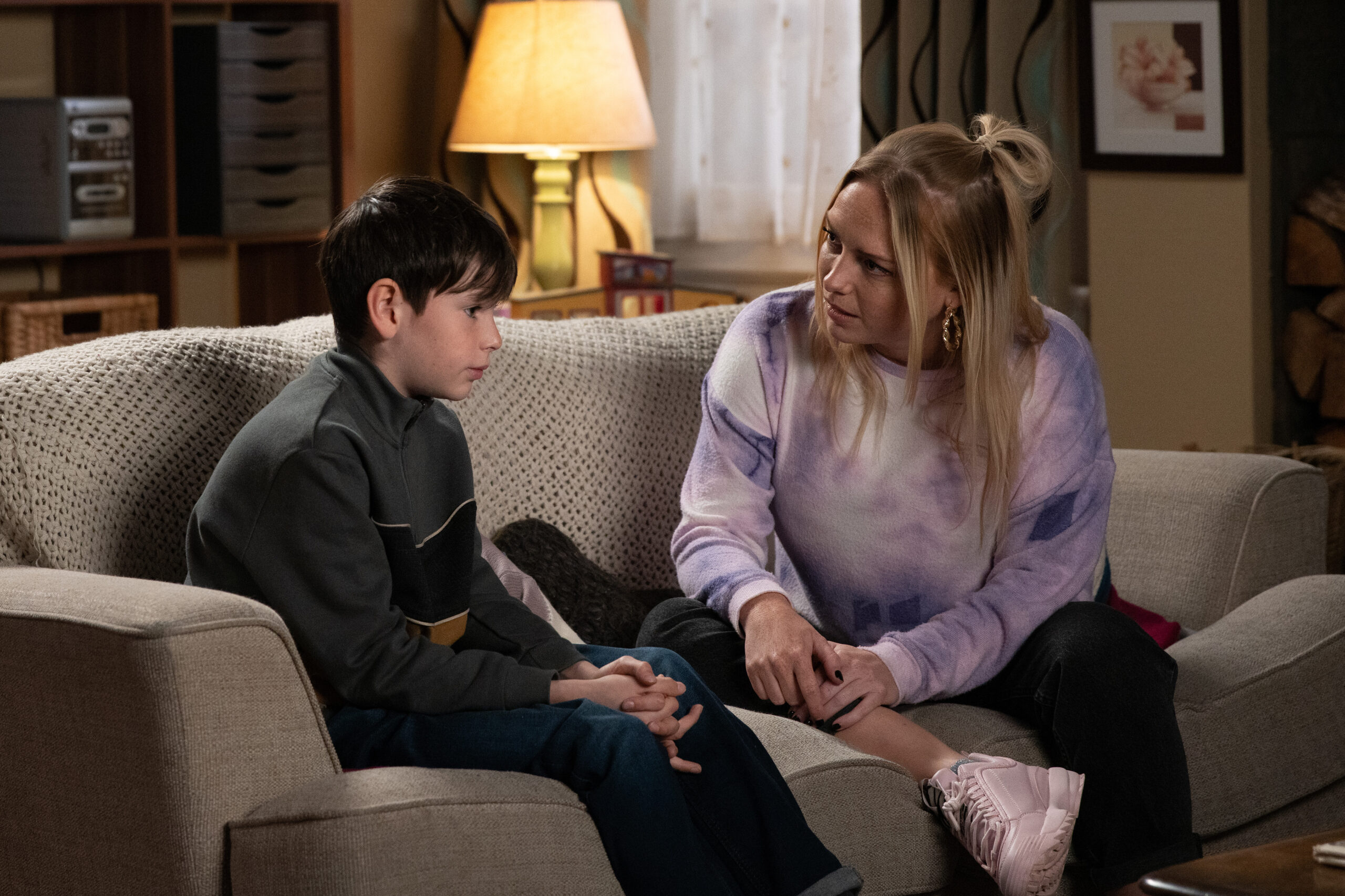 A visibly upset Kyle talks to Amy as they sit together at home on Emmerdale