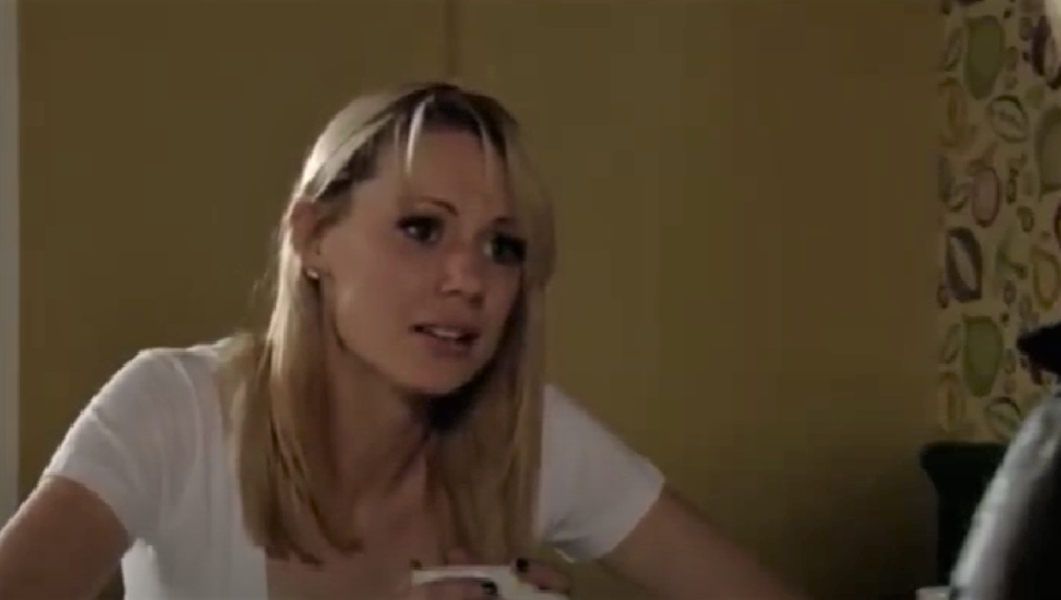 Carly Wicks looking worried at Shirley in EastEnders