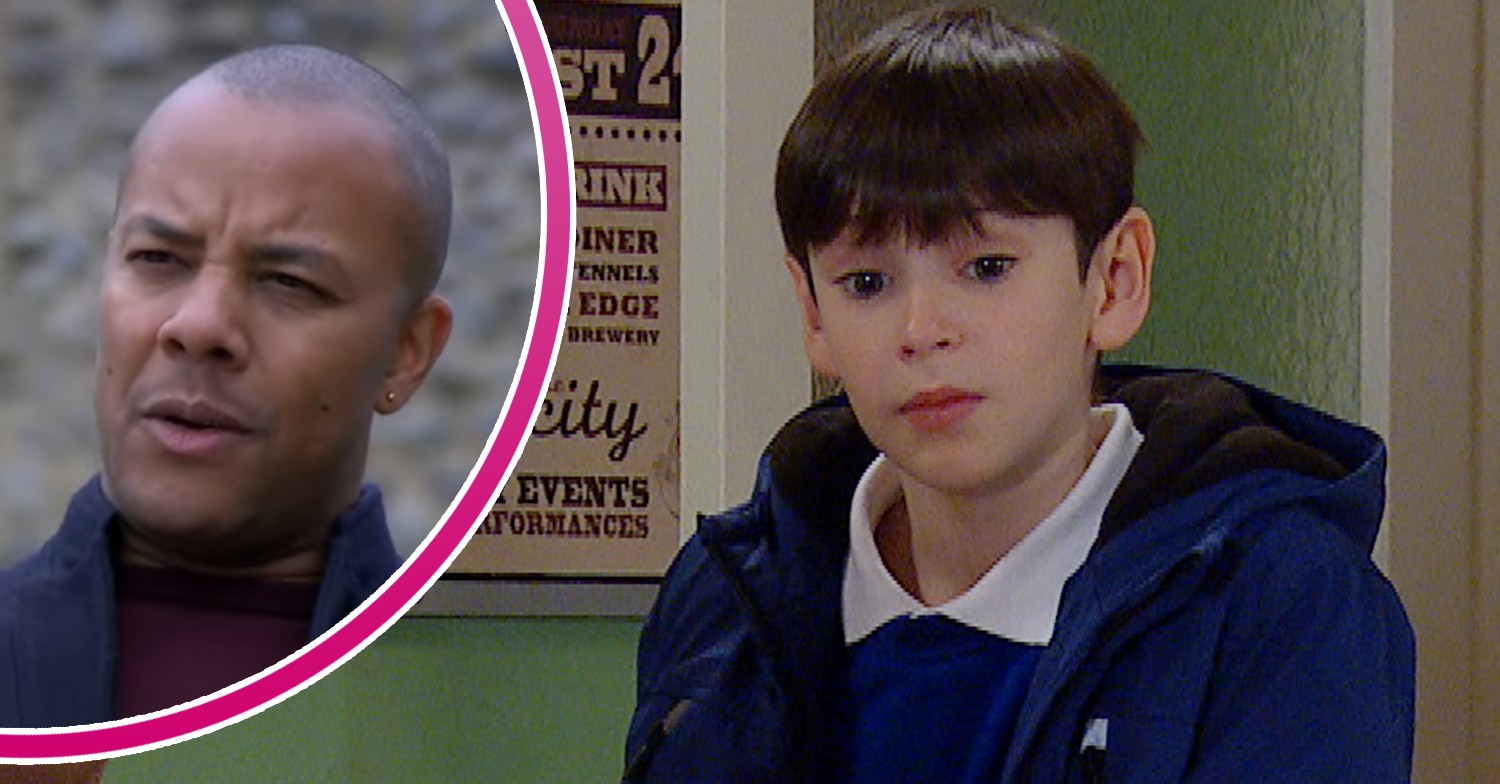 Al Chapman looking worried and Kyle Winchester looking intrigued in Emmerdale