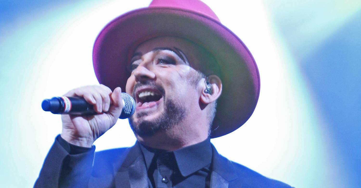 Boy George sings on stage