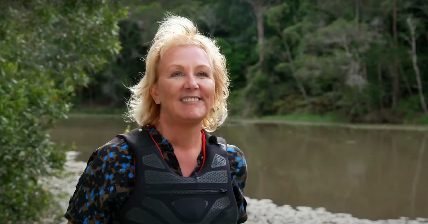 Sue Cleaver smiling by lake on I'm A Celebrity