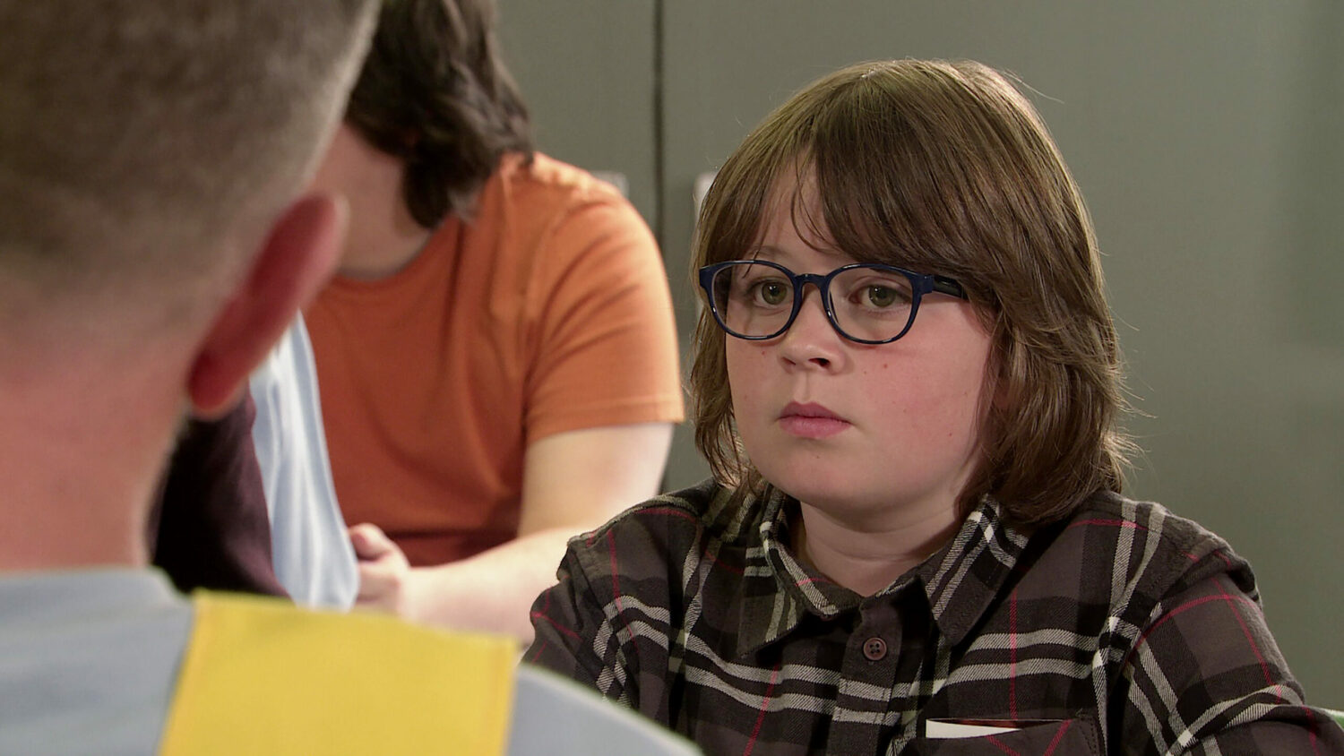 Sam looking sad as he talks with Harvey in prison on Coronation Street