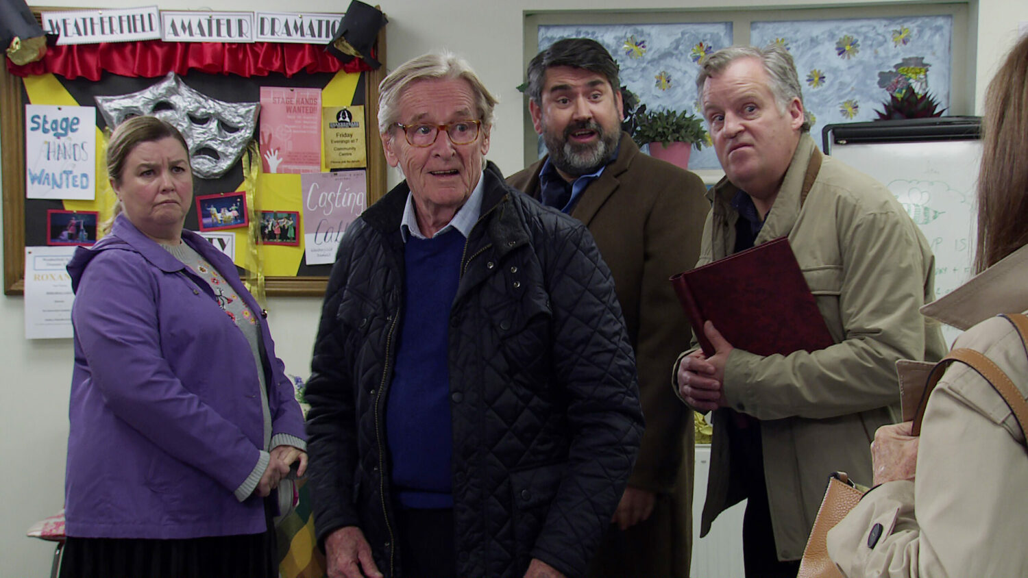 Mary, Ken, Nigel and Brian look shocked as they are faced with a mystery woman
