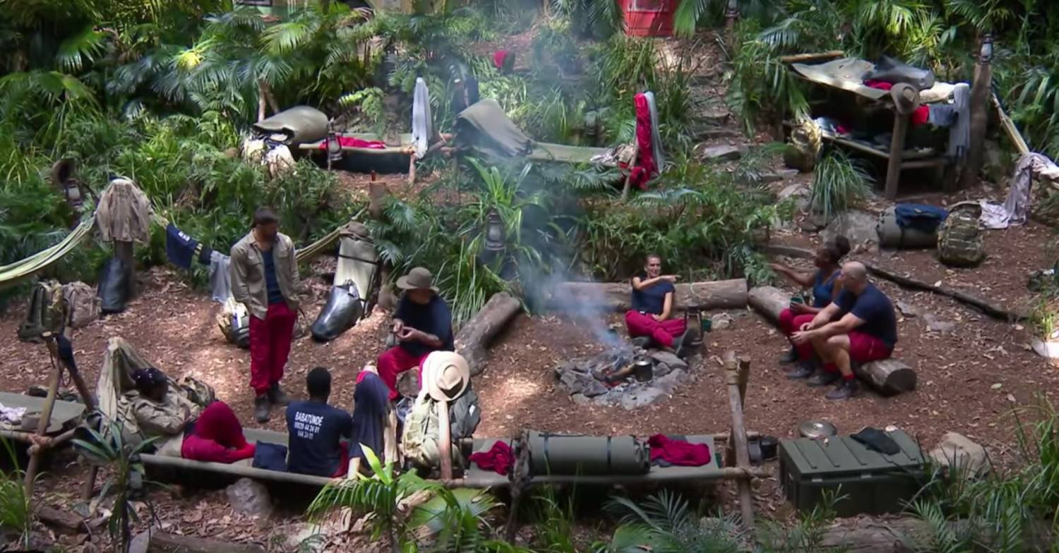 I'm A Celebrity campmates sat around fire pit