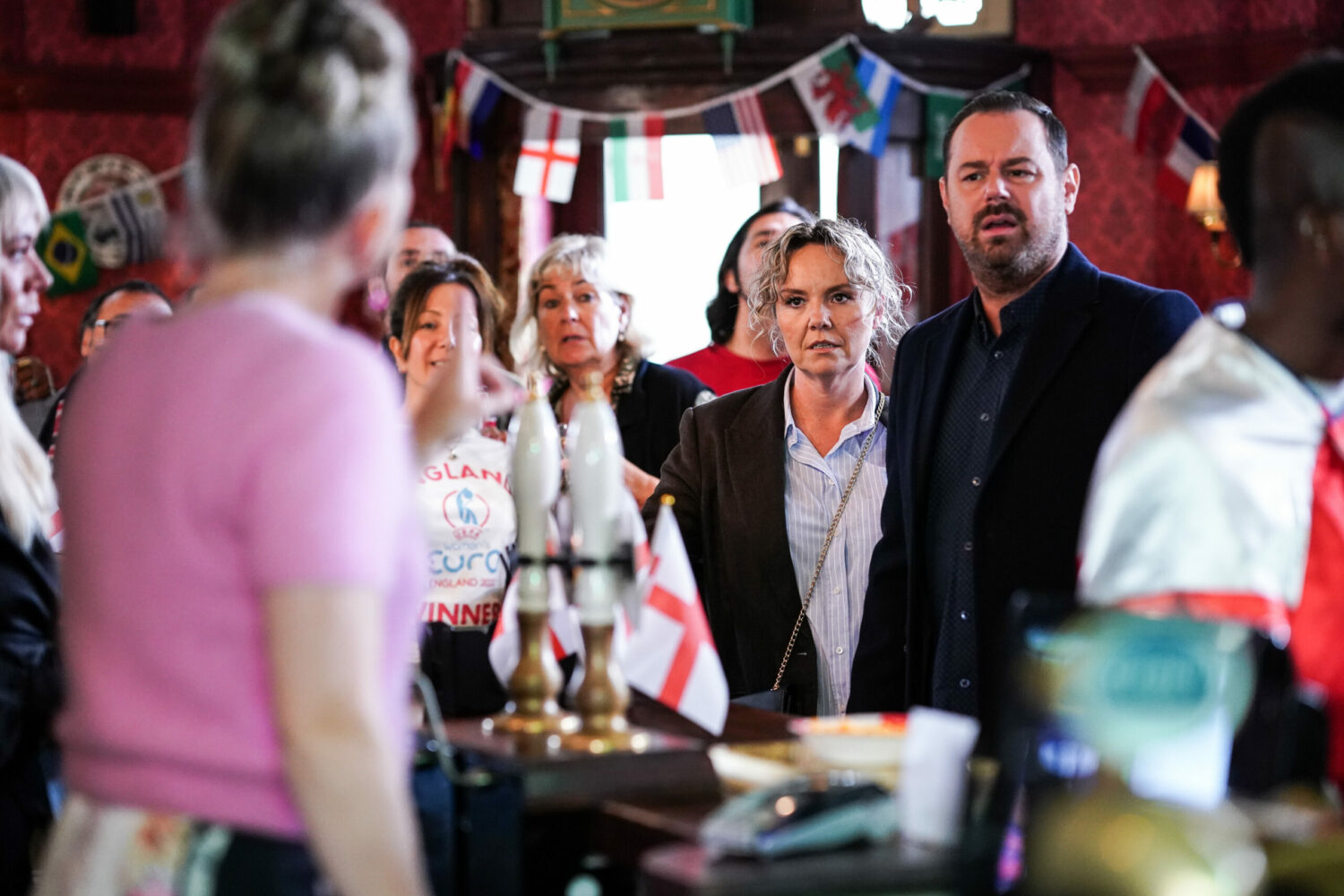 Mick and Janine talk to Linda in the Vic, on EastEnders