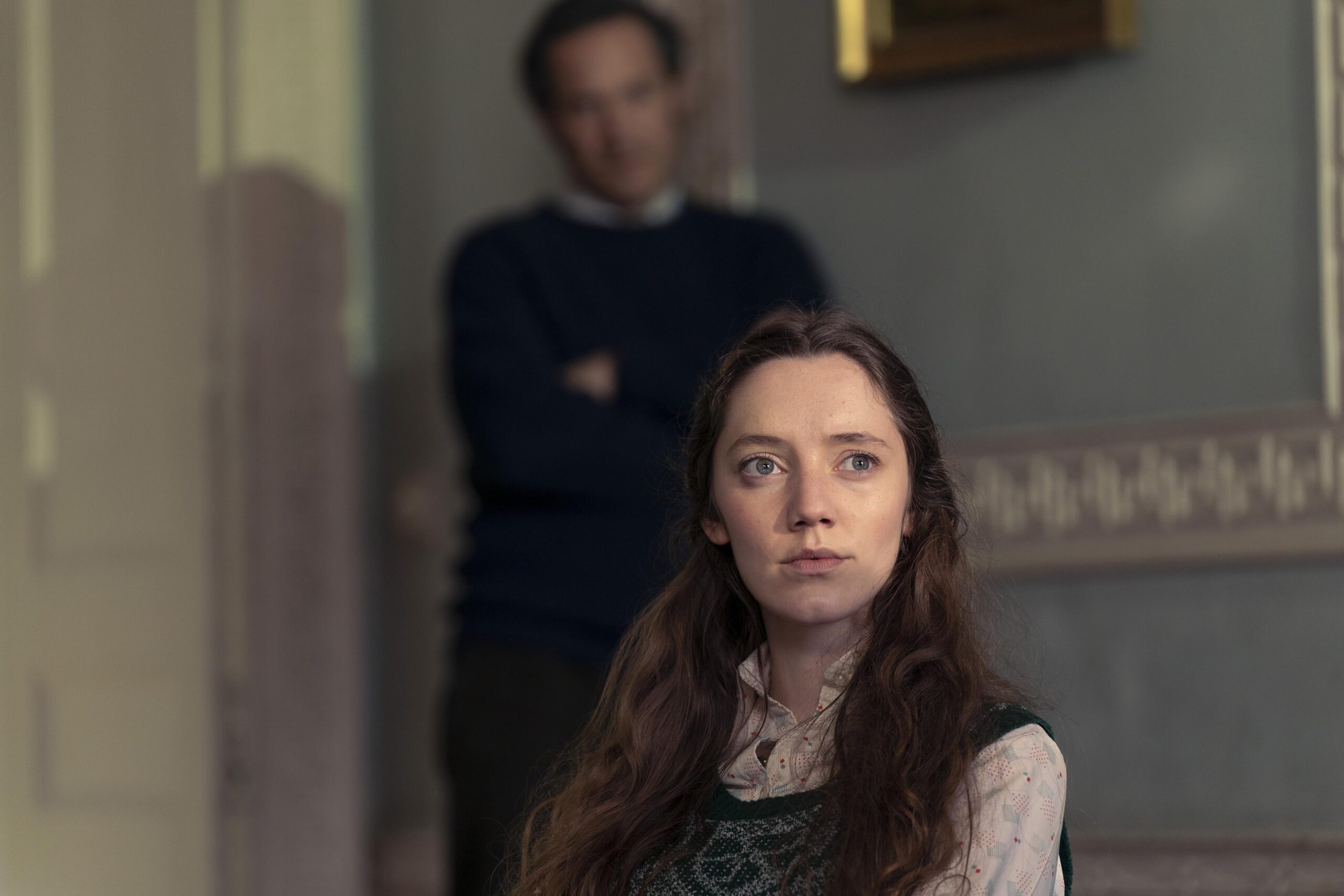 Maggie Hewson sits down with an upset expression