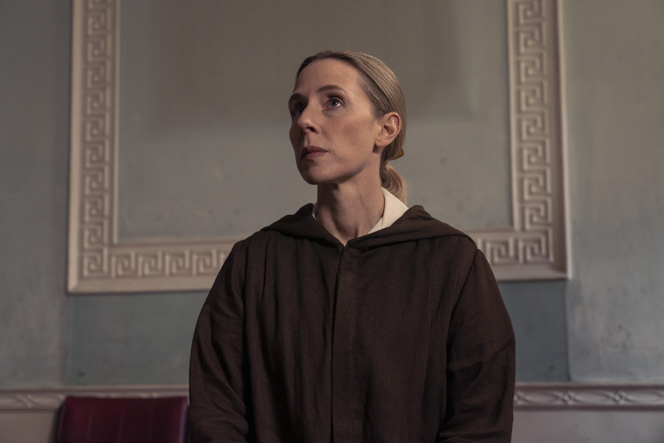 Helen sits in a robe as she speaks to Dalgliesh