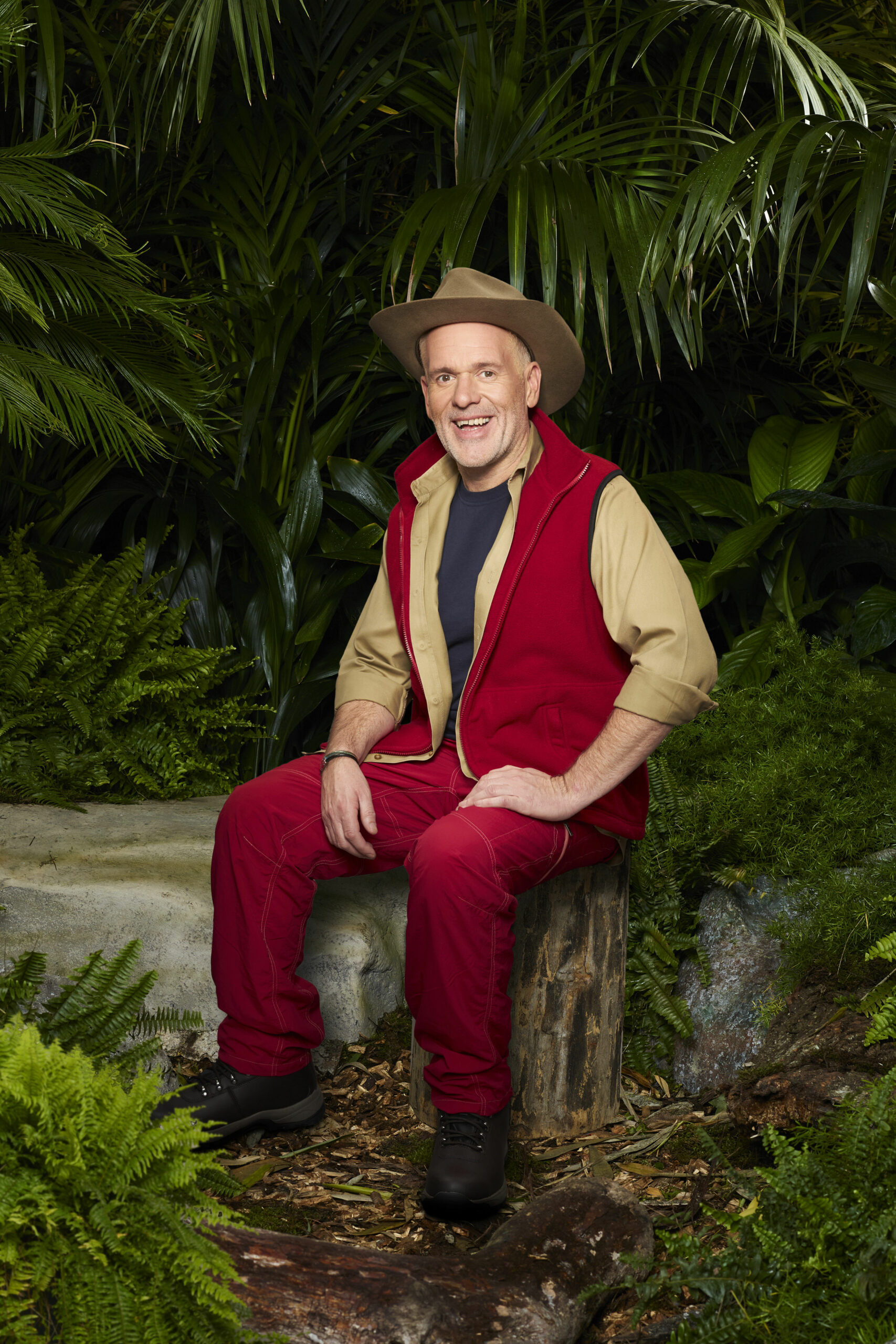Chris Moyles sat down in I'm A Celebrity promo pic