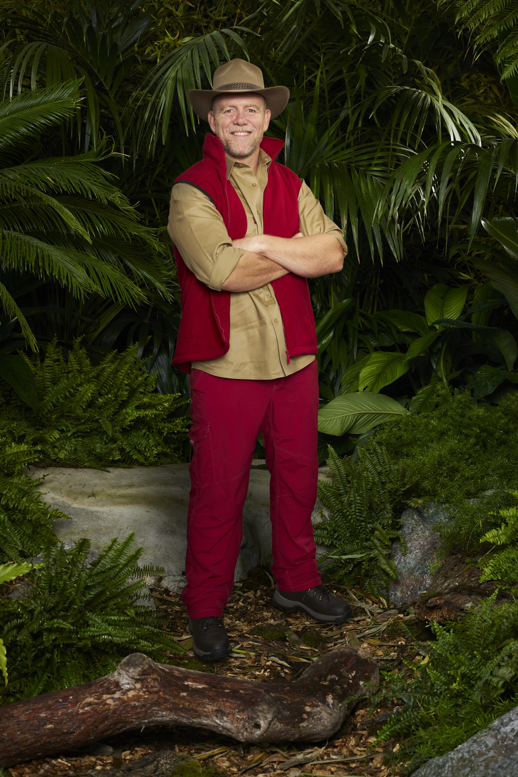 Mike Tindall crosses his arms and smiles in I'm A Celebrity promo pic