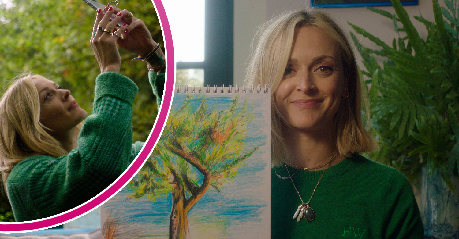 Fearne Cotton holding a painting and smiling