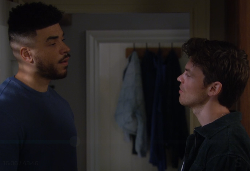 Nate and Marcus have a tense conversation as they look annoyed in Emmerdale