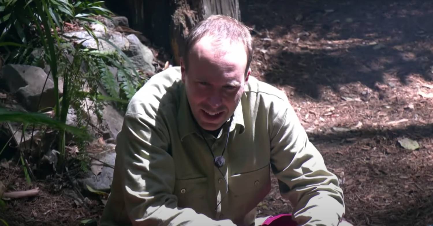 Matt Hancock smiles through the pain