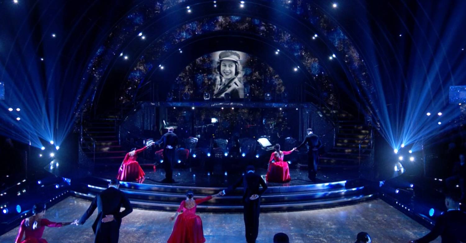 Strictly pros bow to an image of the Queen