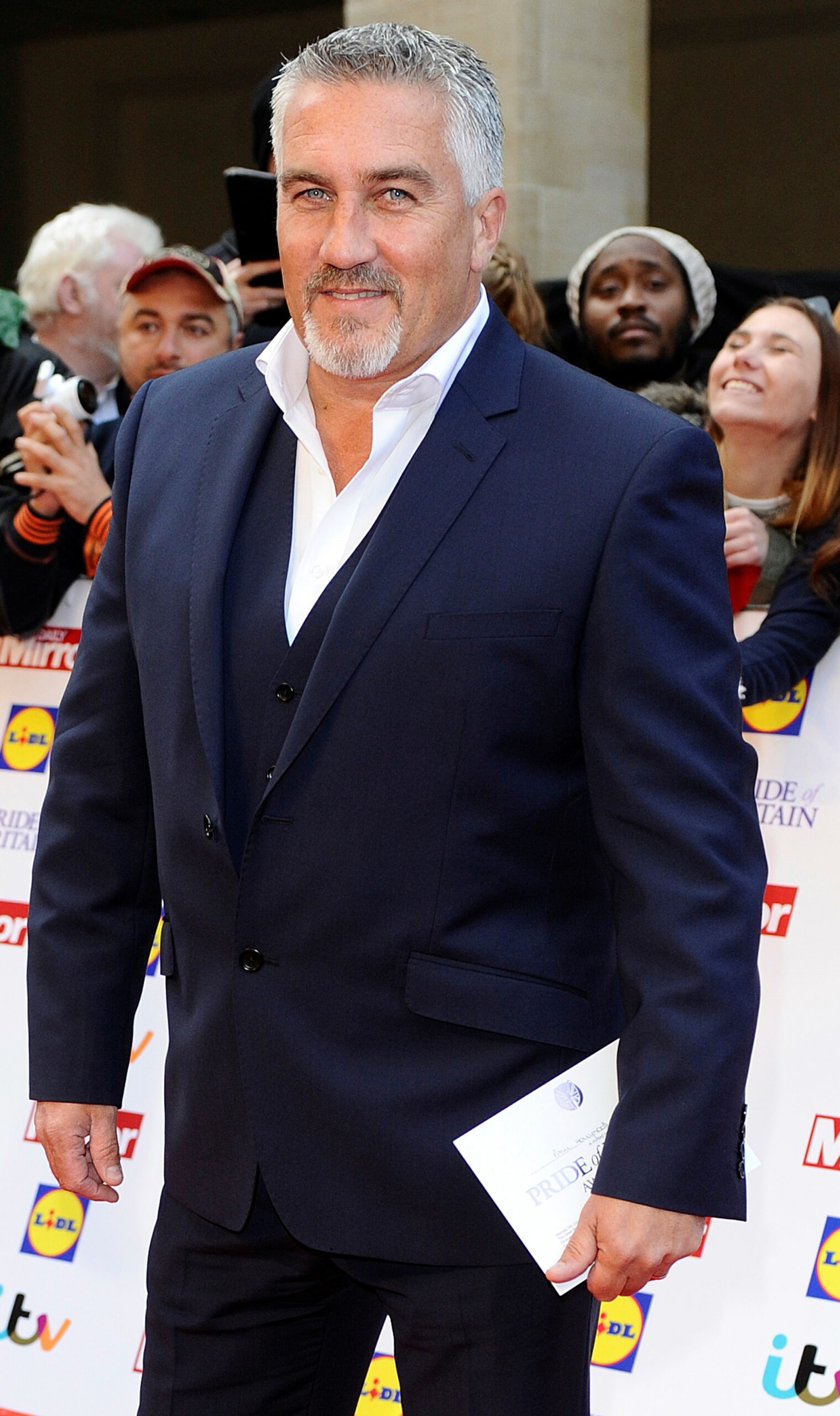 Paul Holywood smiling in suit at awards