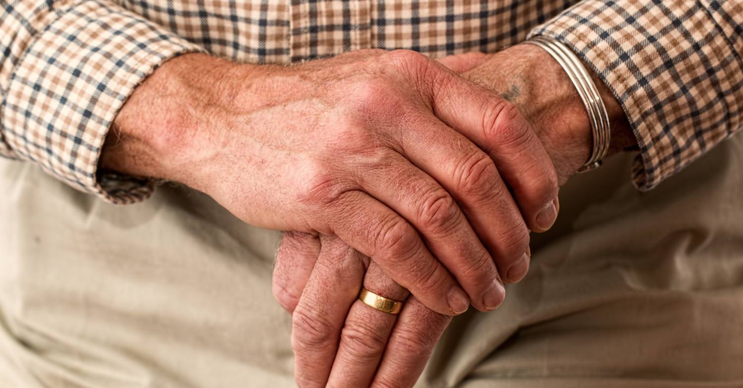 A man rubs his hands