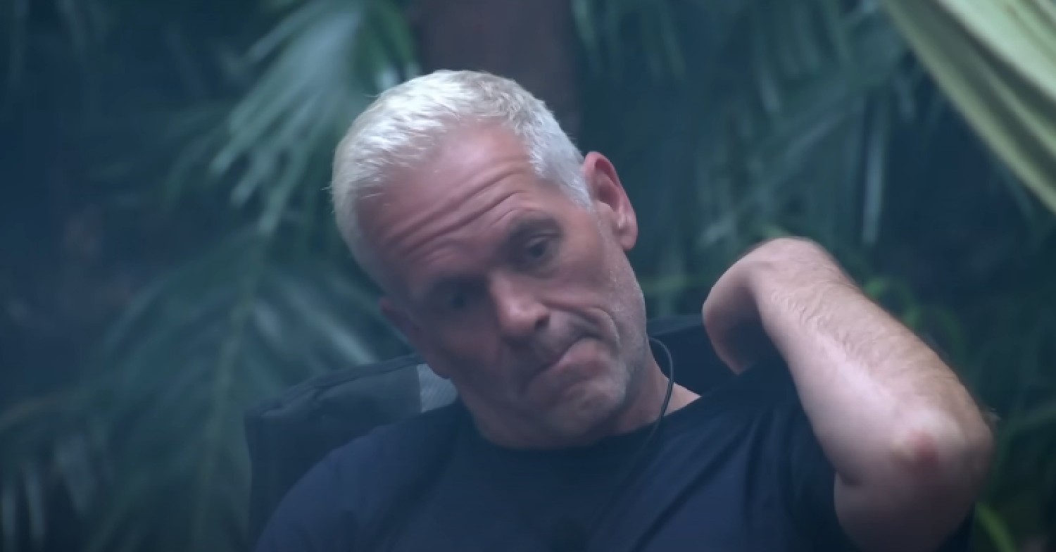 Chris Moyles itching his shoulder on I'm A Celebrity