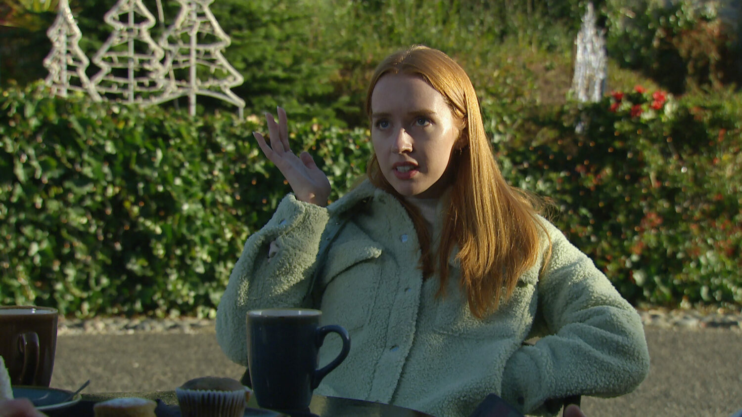 Chloe looks frustrated in Emmerdale as she reveals her pregnancy outside the cafe