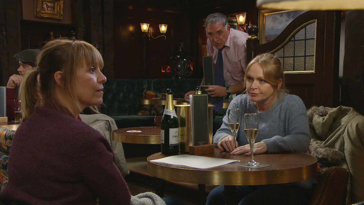 Emmerdale: Bob leans over being nosey as annoyed Rhona and Vanessa look away from each other