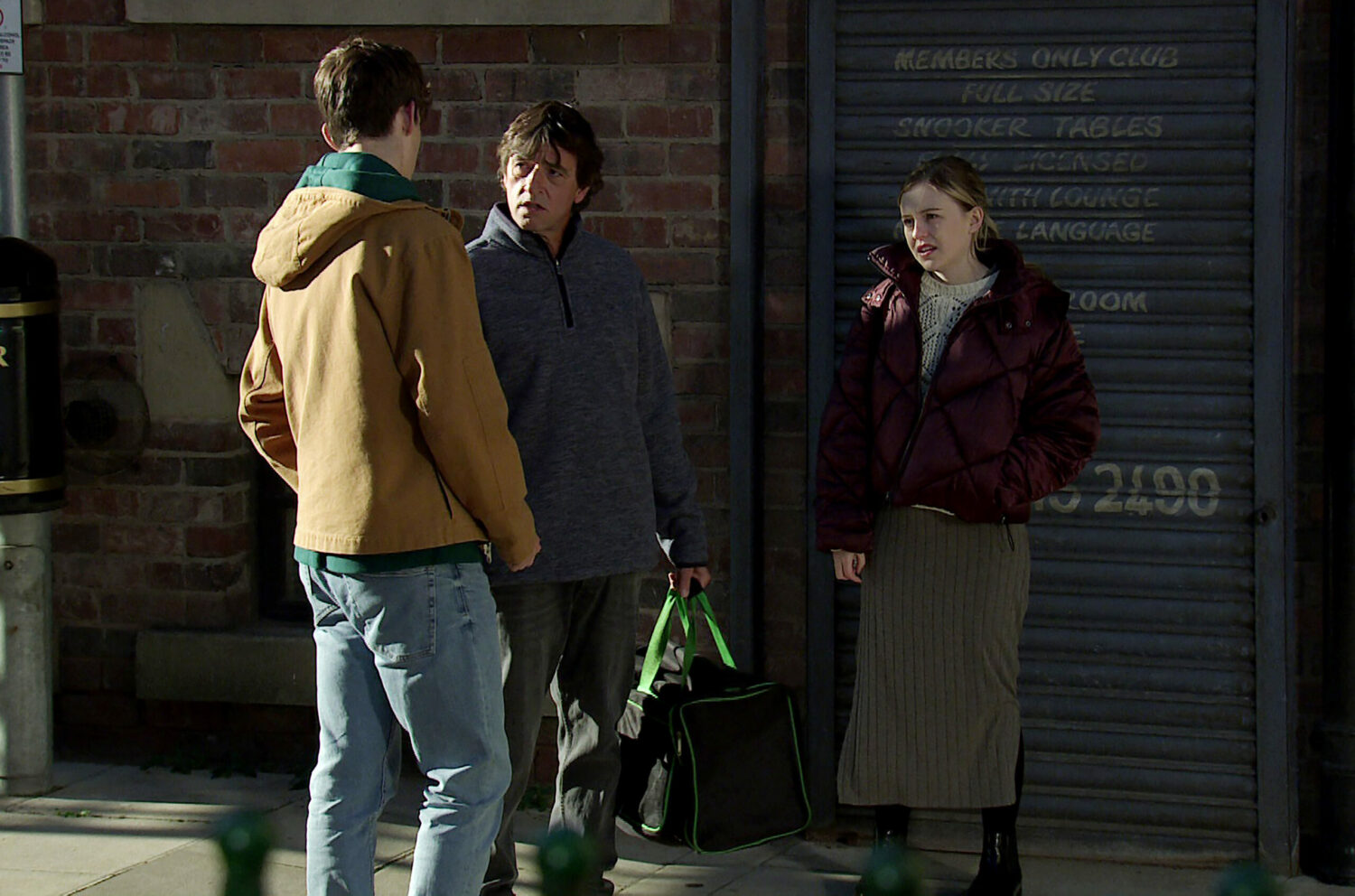 Eric talks to Summer and Aaron in the street in Coronation Street