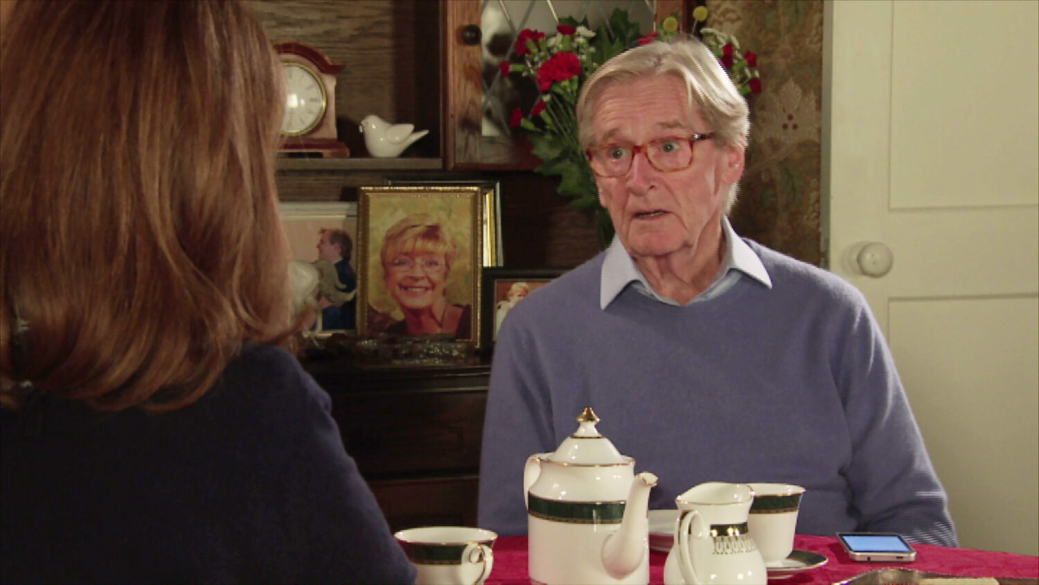 Ken and Martha share a cup of tea in Ken's home on Coronation Street