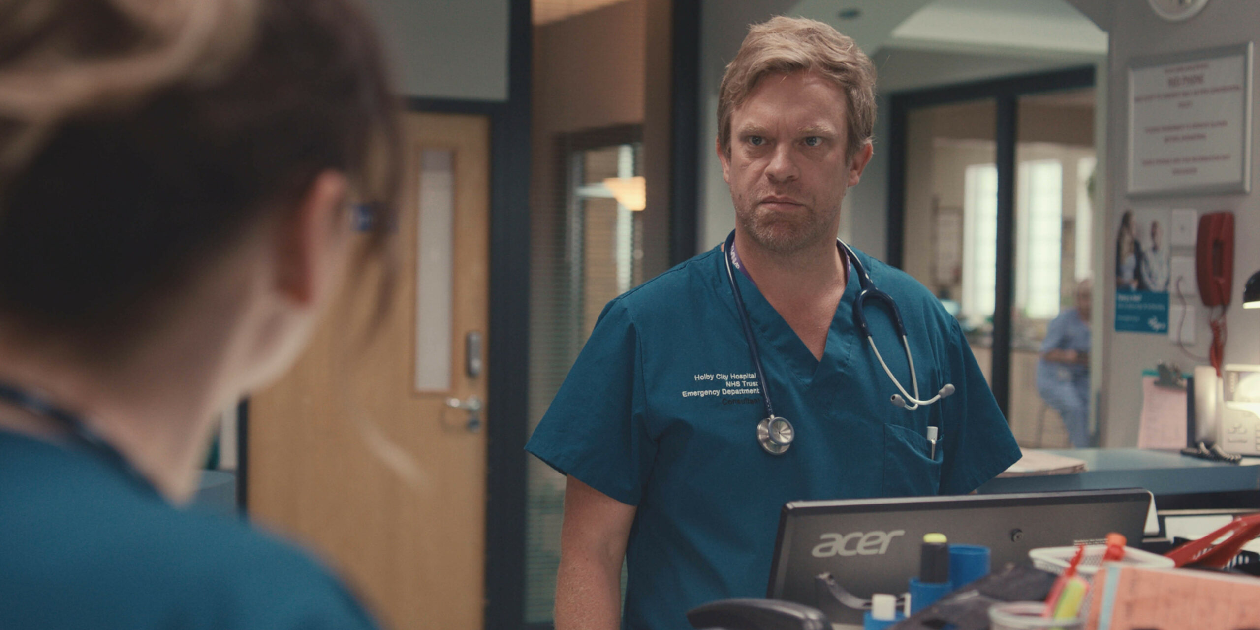 Dylan looking concerned at Stevie in Casualty 