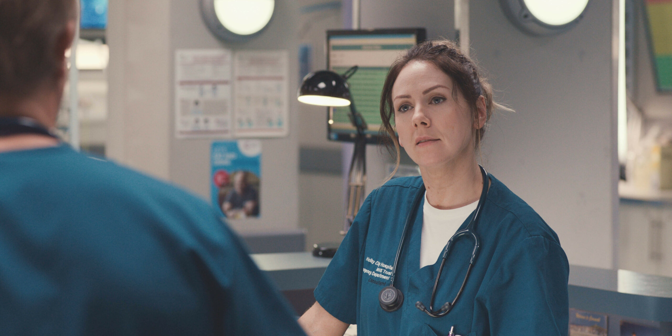 Stevie looking annoyed at Dylan in Casualty 