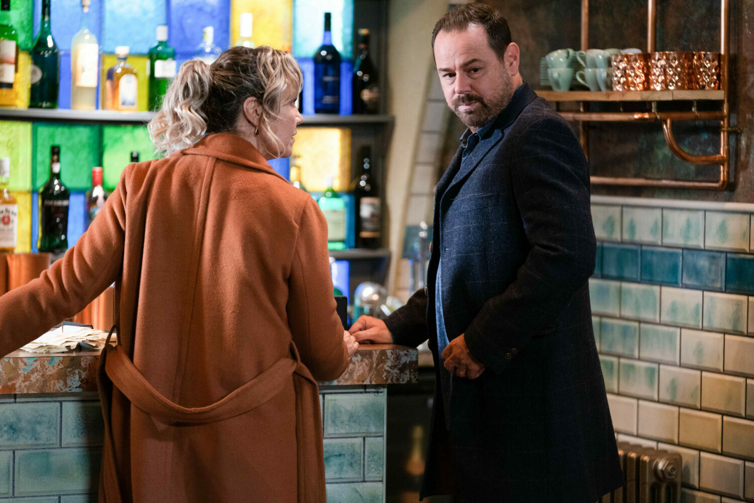 Janine looking angry at Mick in EastEnders