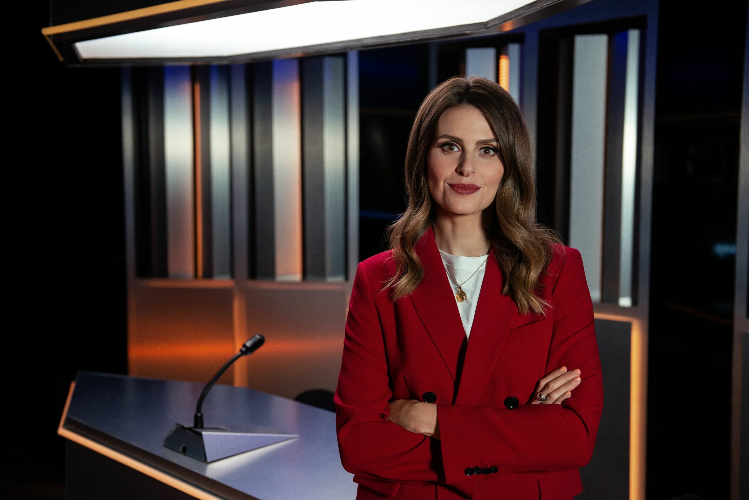 Ellie Taylor crossing her arms in You Won't Believe This