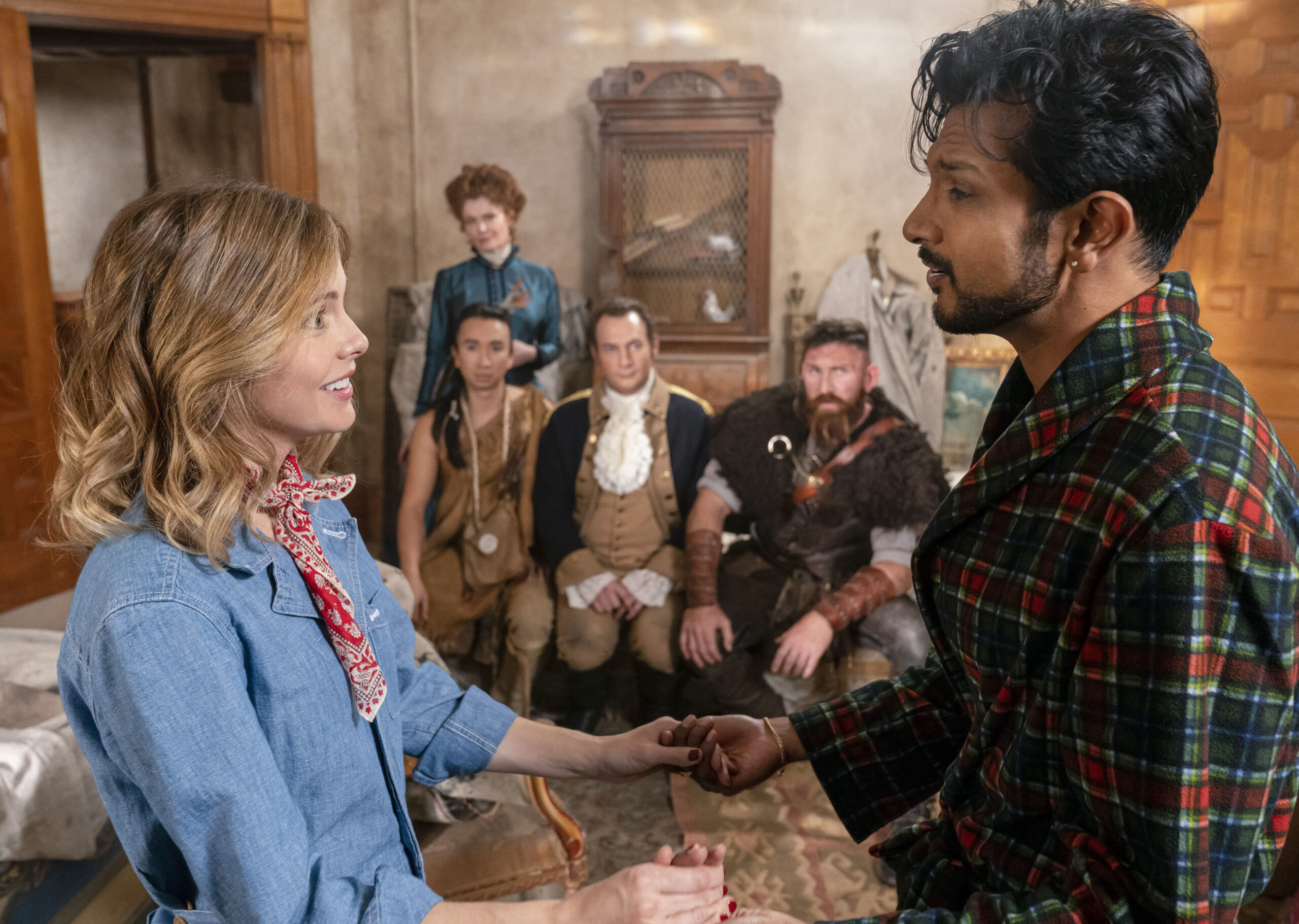 Sam and Jay holds hands with all the Ghosts US sit behind them