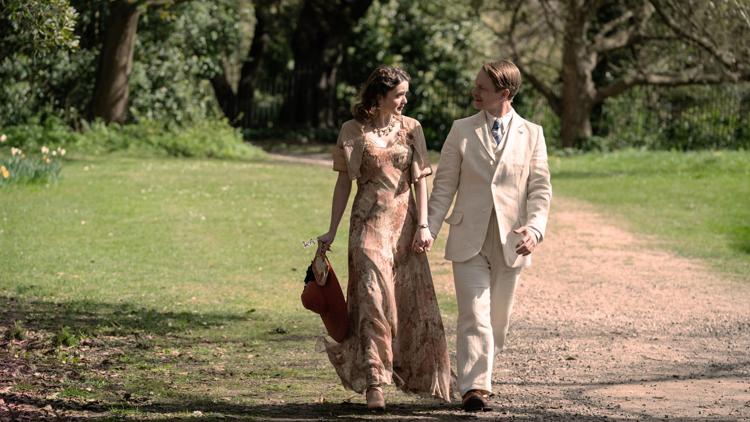Isobel Laidler and Alfie Allen holding hands in SAS Rogue Heroes