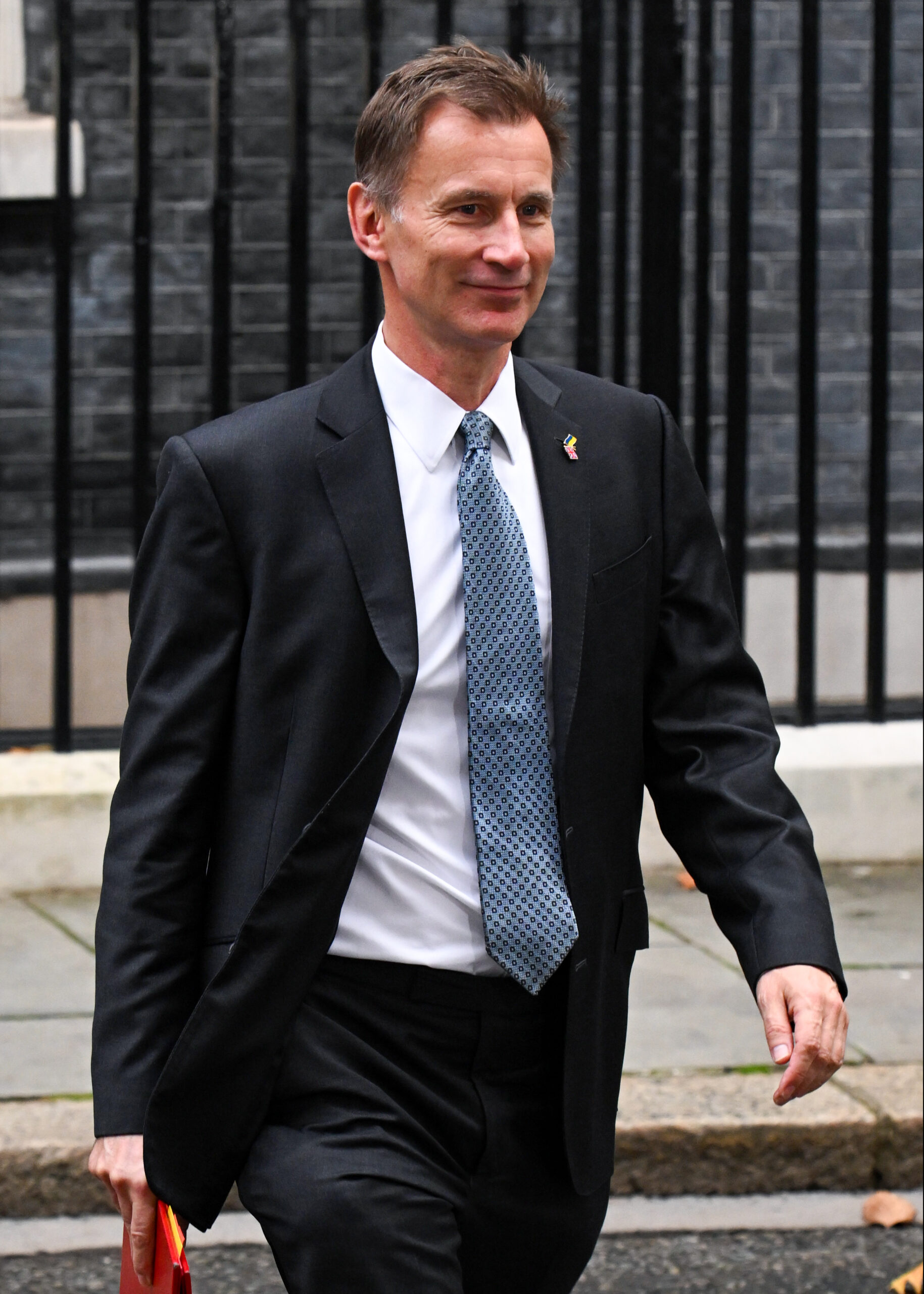 Jeremy Hunt smiling leaving Downing Street