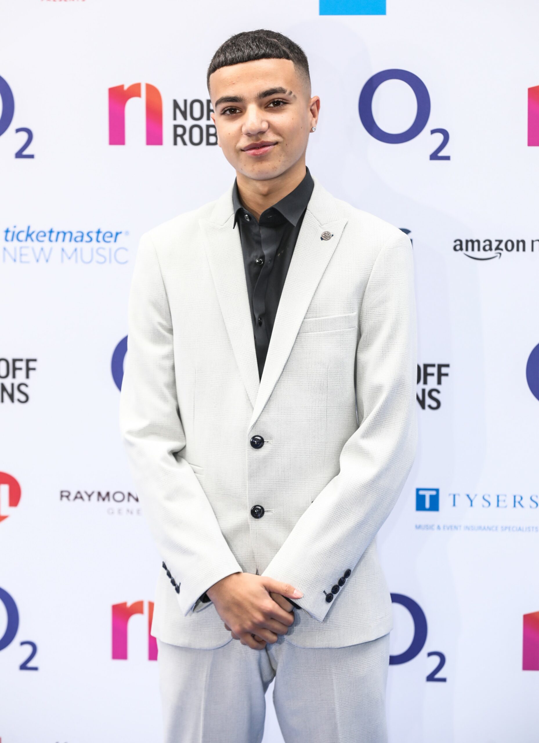 Peter Andre son Junior smiles at awards