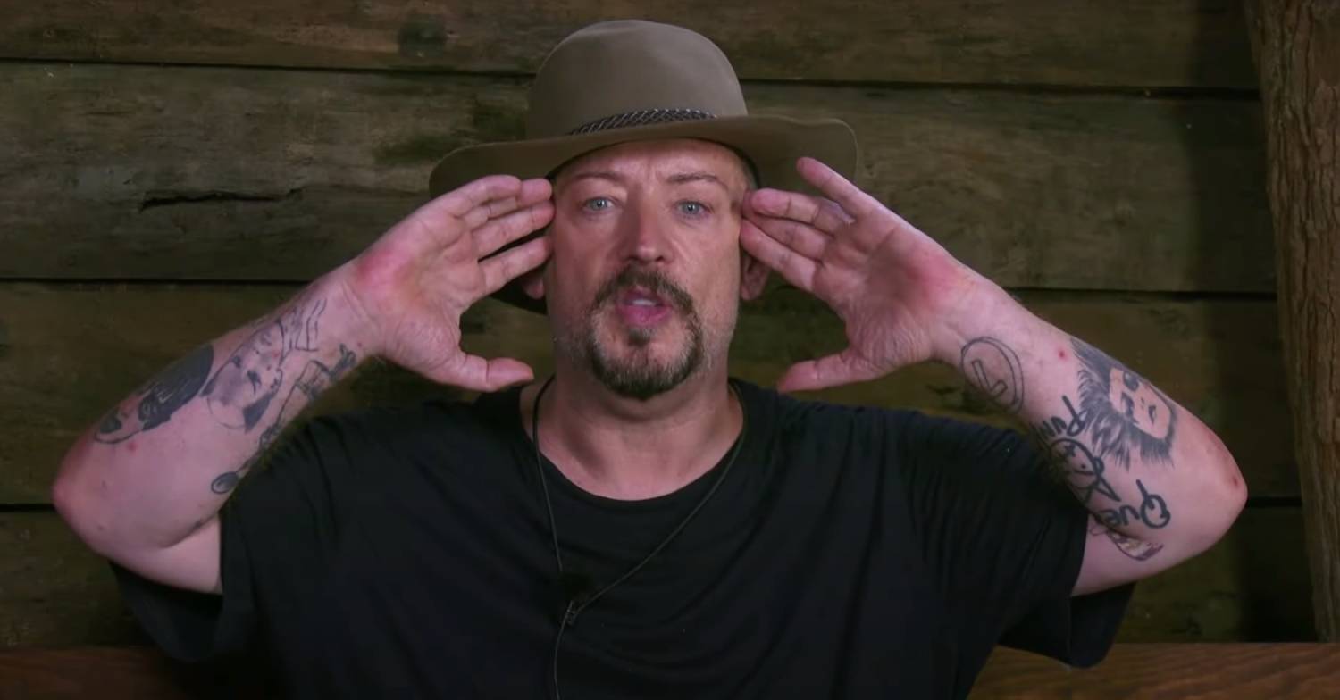 I'm A Celebrity contestant Boy George puts his hands to his temples