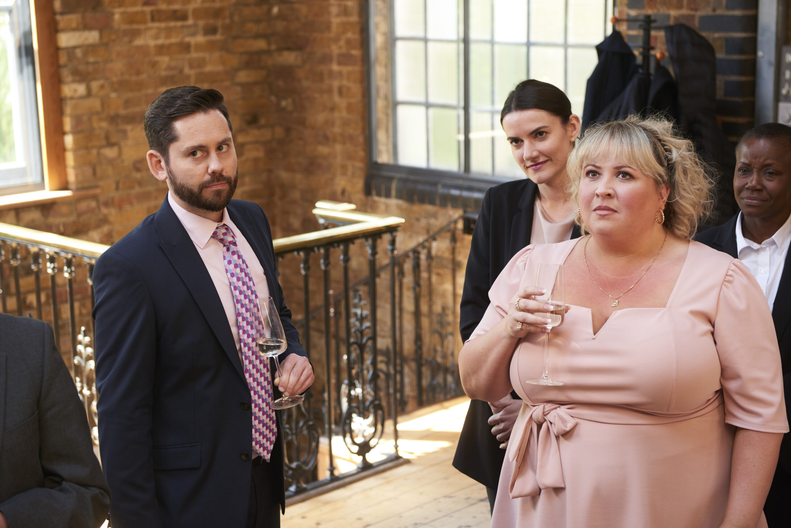 Robert looks concerned, standing next to Monica