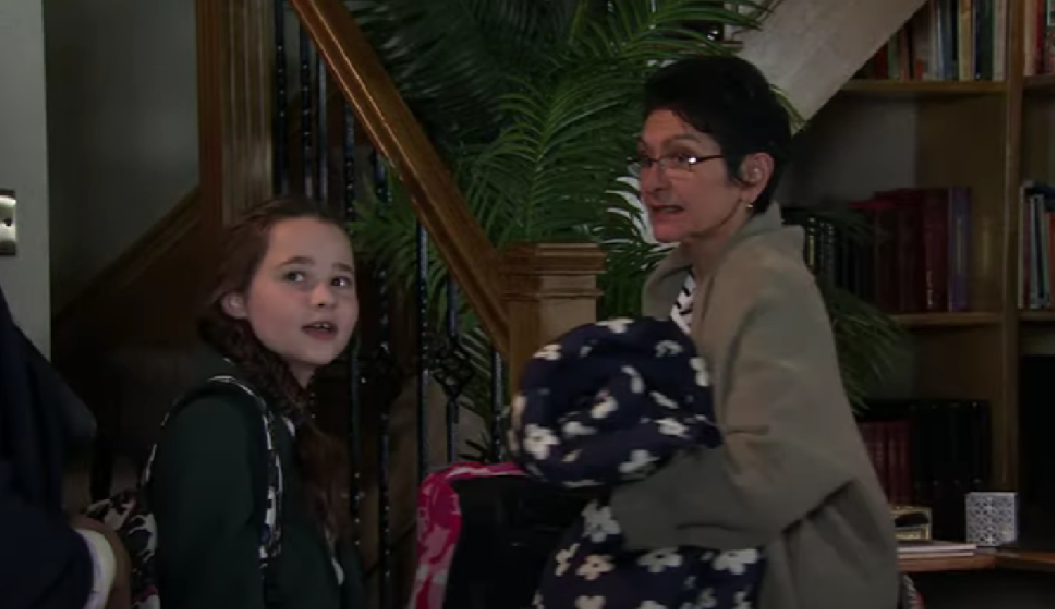 Eliza and Yasmeen looking at the social worker in Corrie 