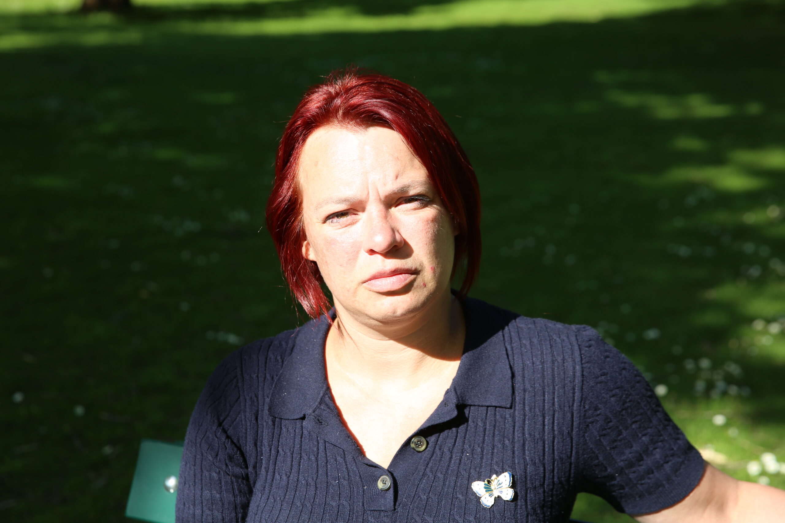 Sarah Newton sitting on a bench