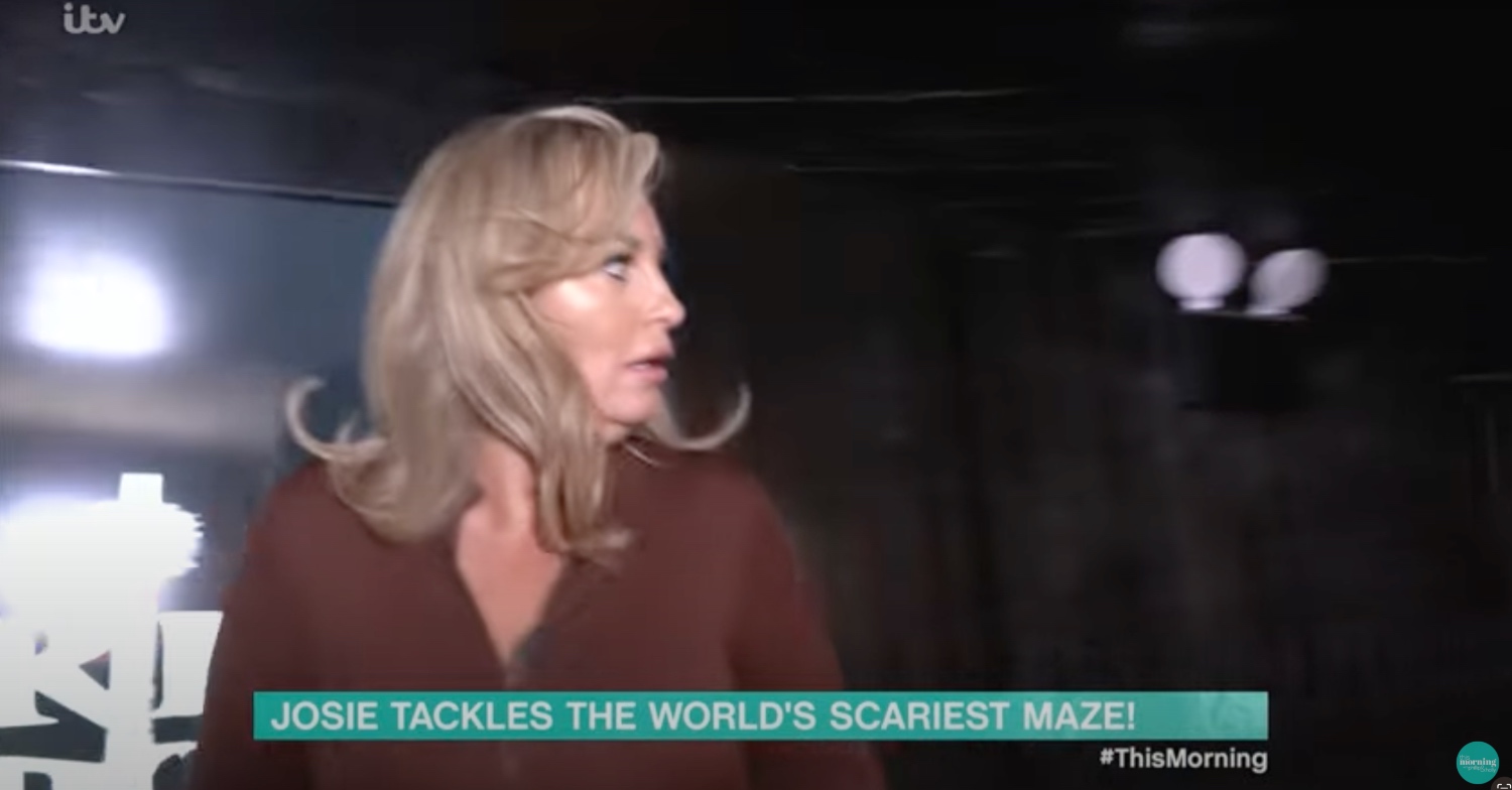 Josie Gibson looking scared in a haunted house