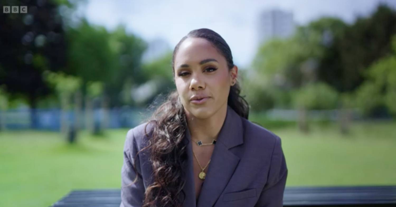 Alex Scott speaks to camera, maybe about her parents