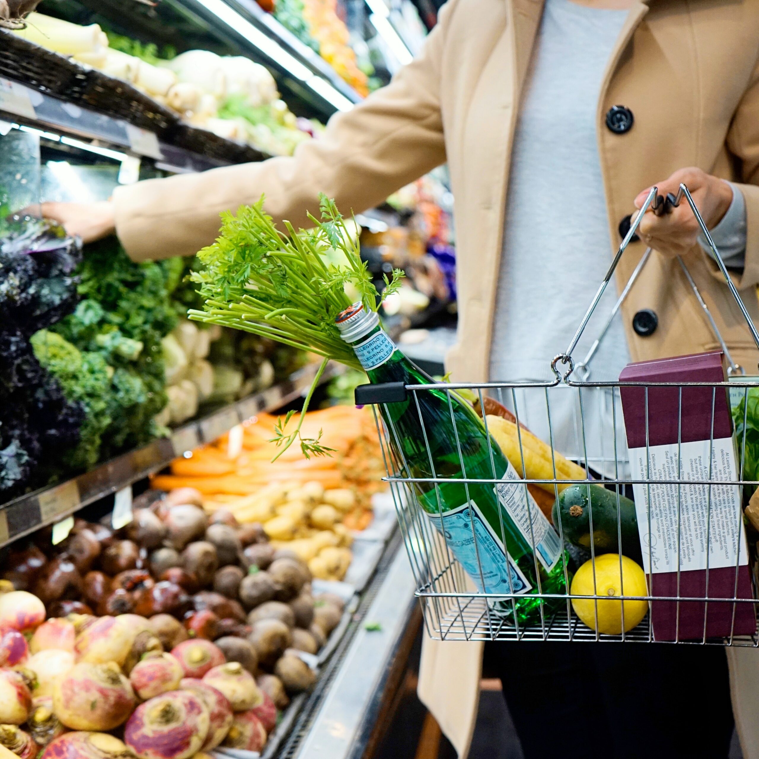 Woman shopping holding a basket