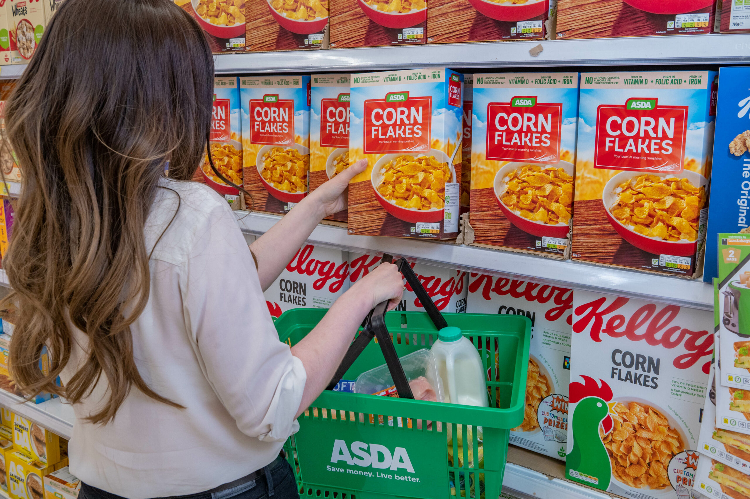 Person looking at own-brand cereal amid cost of living crisis