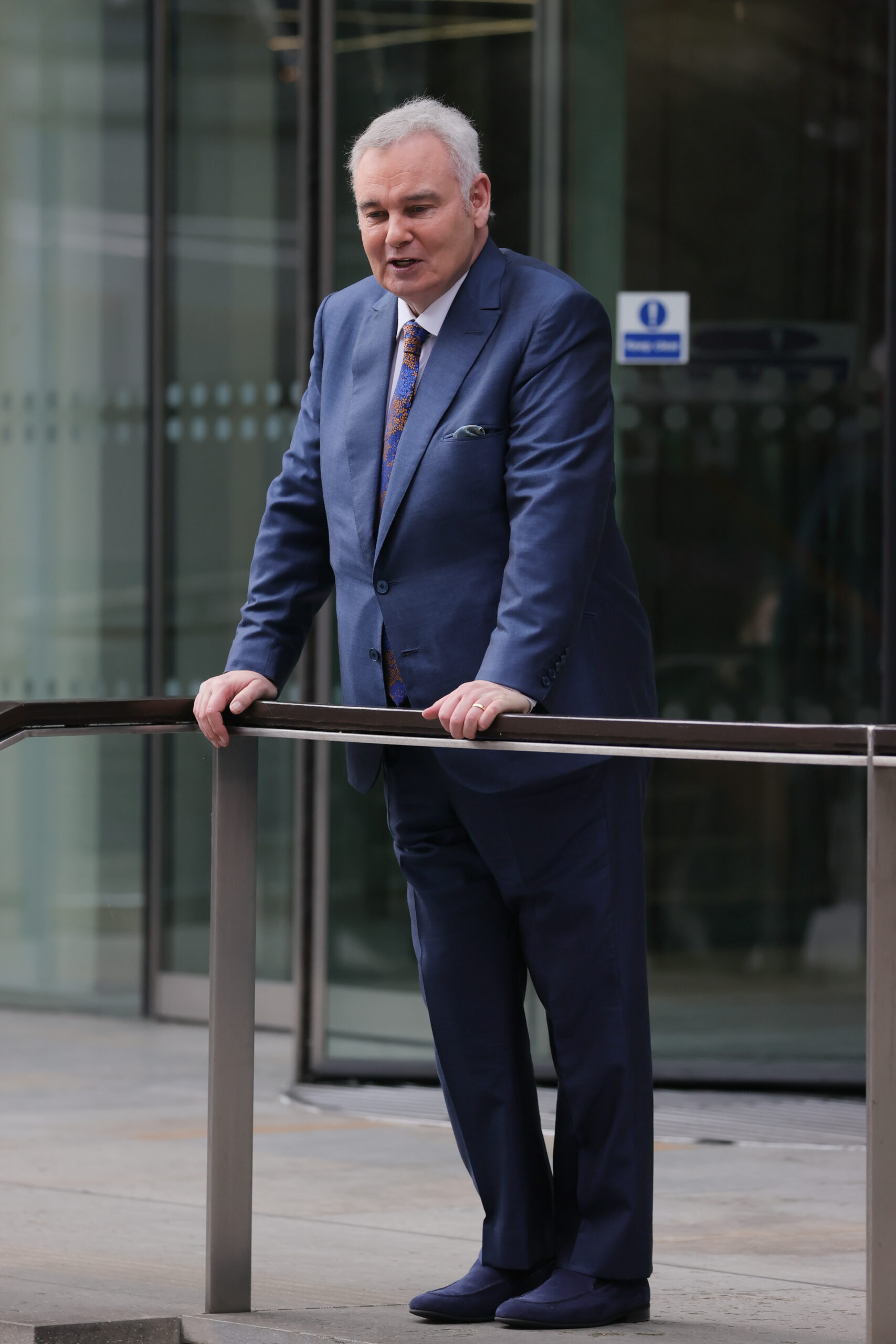 Eamonn Holmes wearing a navy suit