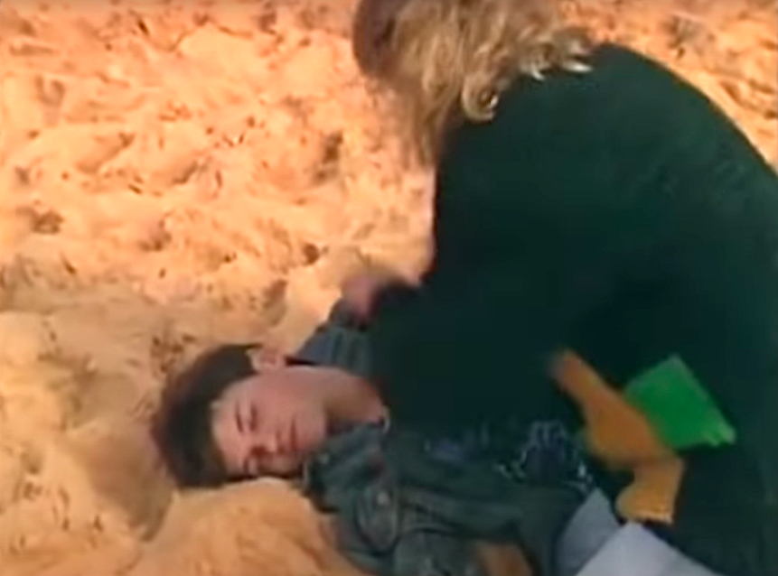 Alan collapses on the beach H&A