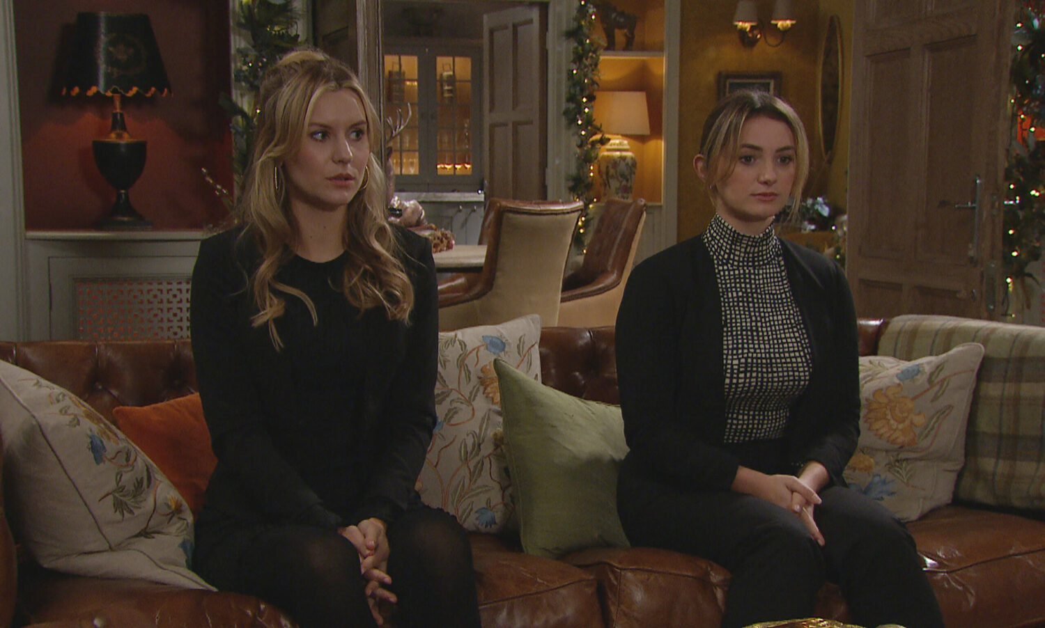 Dawn and Gabby both look concerned as they sit down