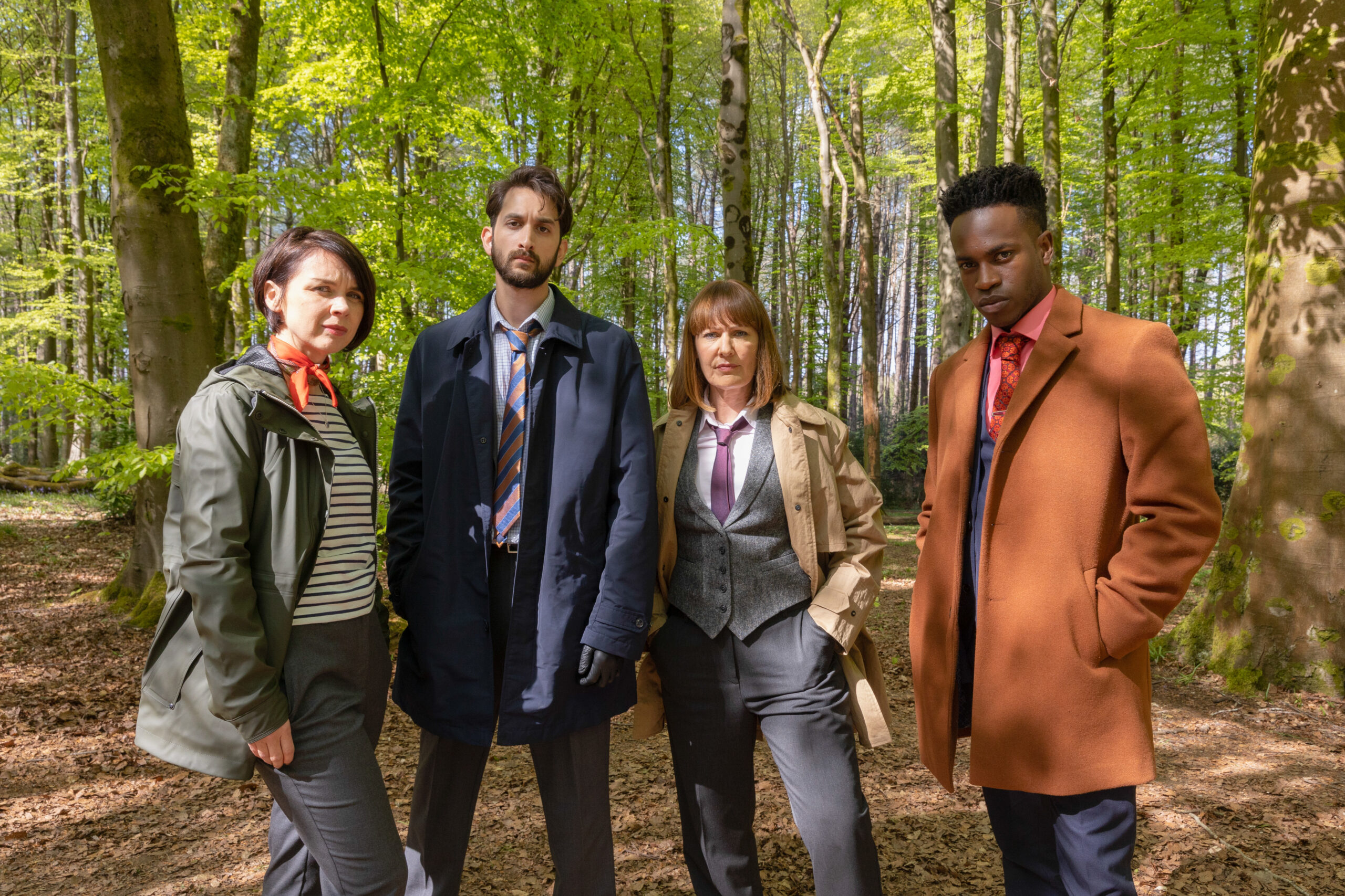 The cast of Granite Harbour pose in the woods