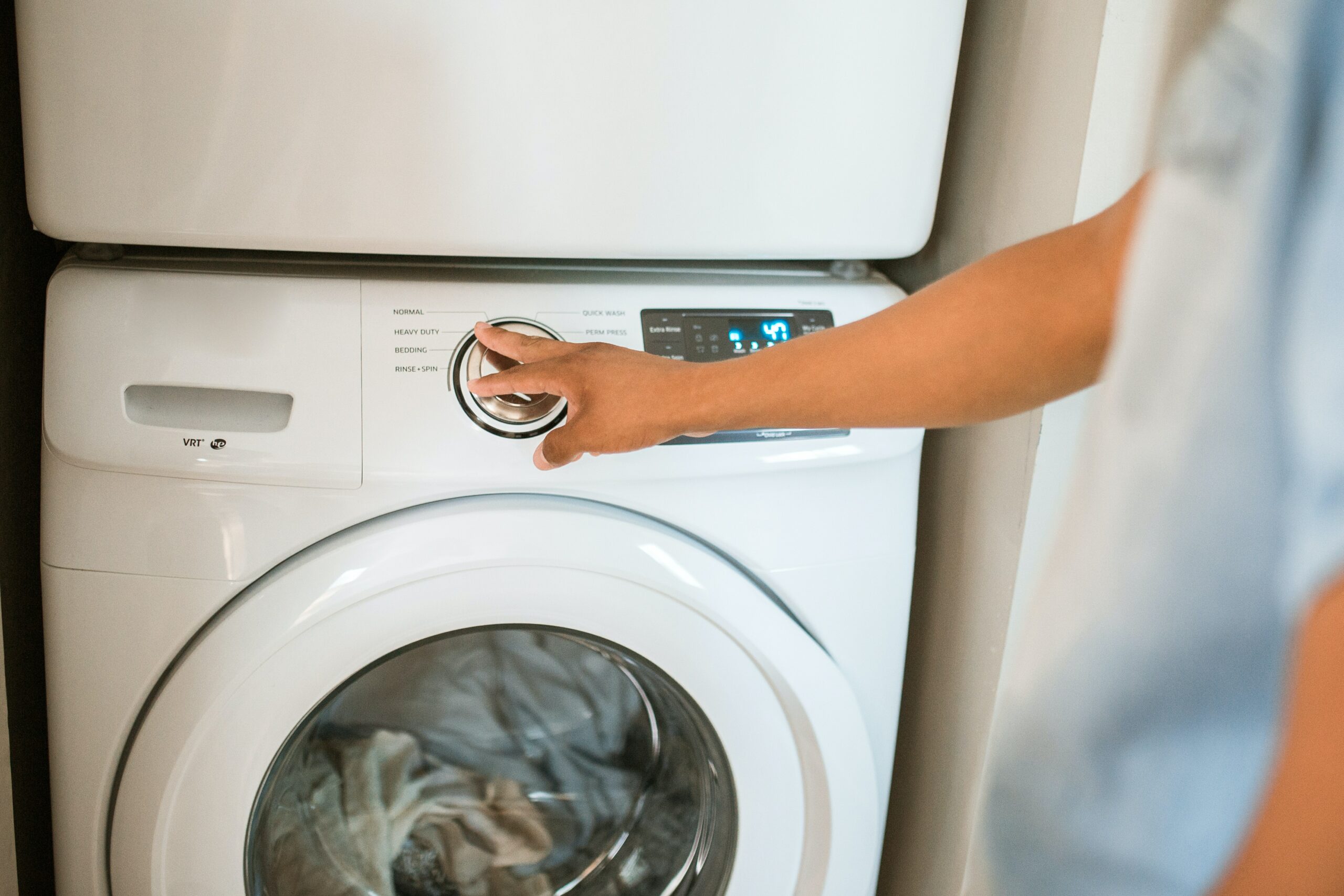 Person operating a tumble dryer