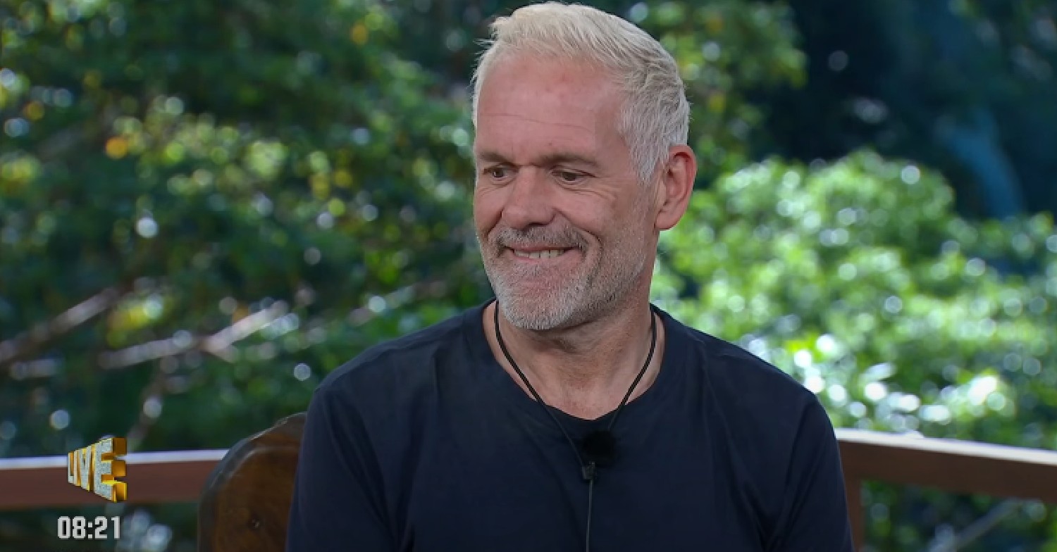 Chris Moyles smiling in I'm A Celebrity exit interview