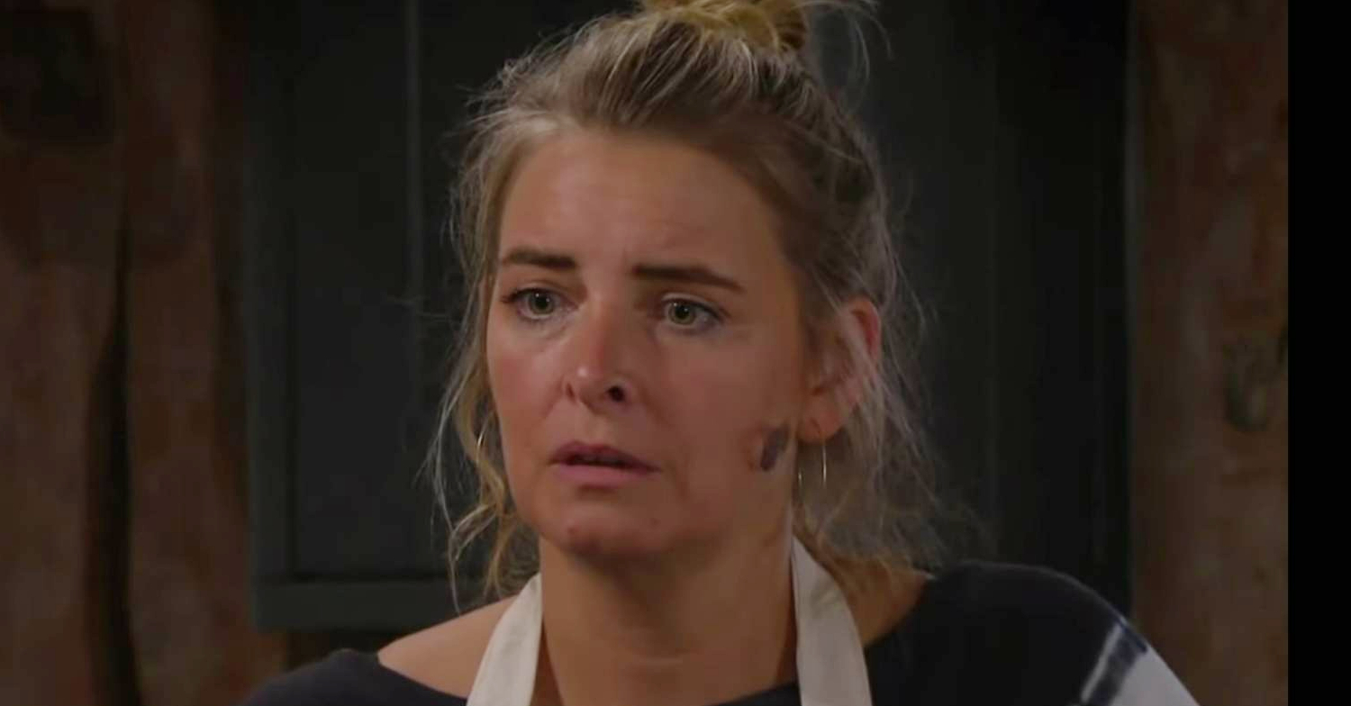 Charity is looking shocked, with dirt on her face in Emmerdale 