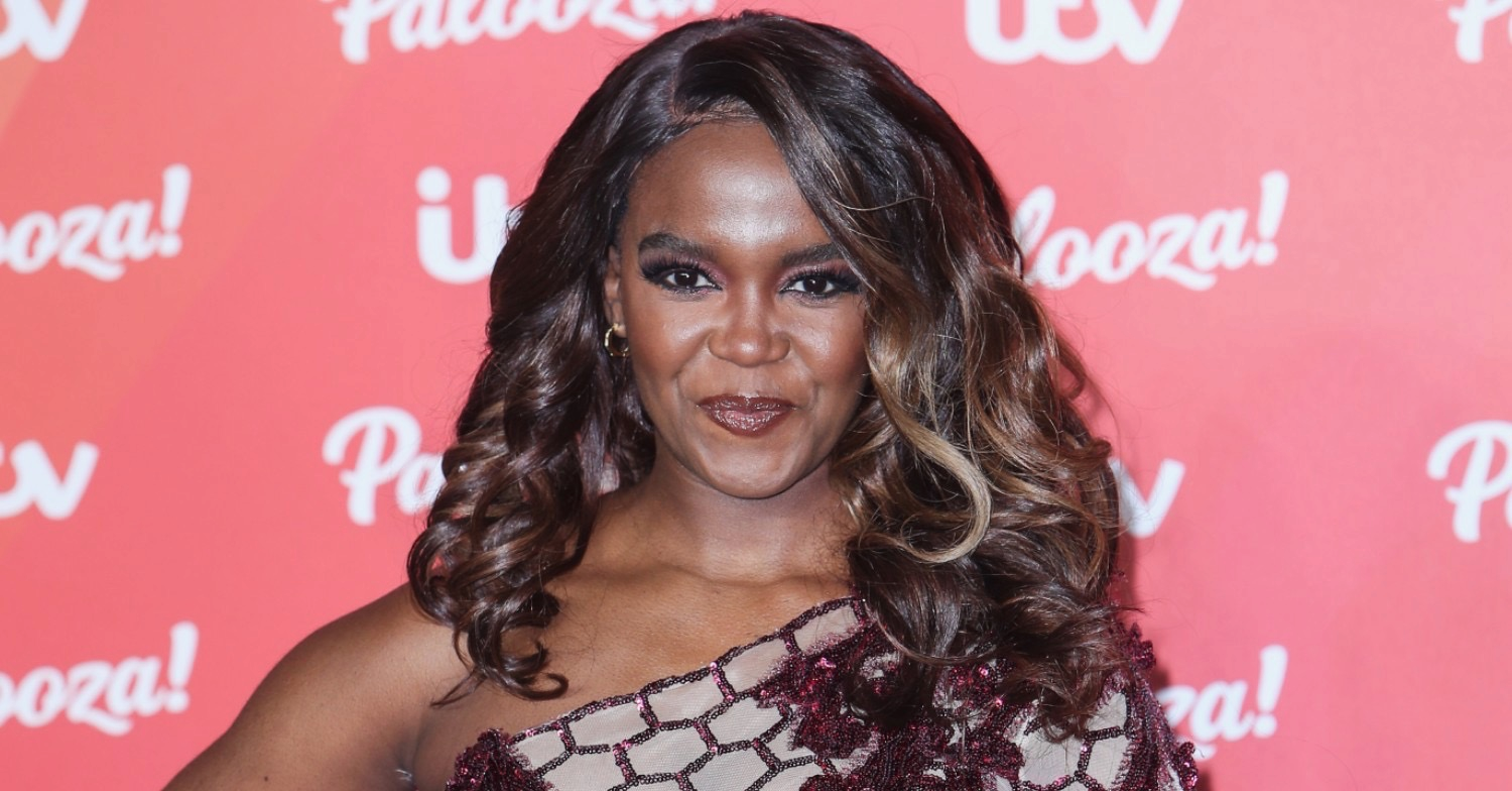 Oti Mabuse smiling at the camera 