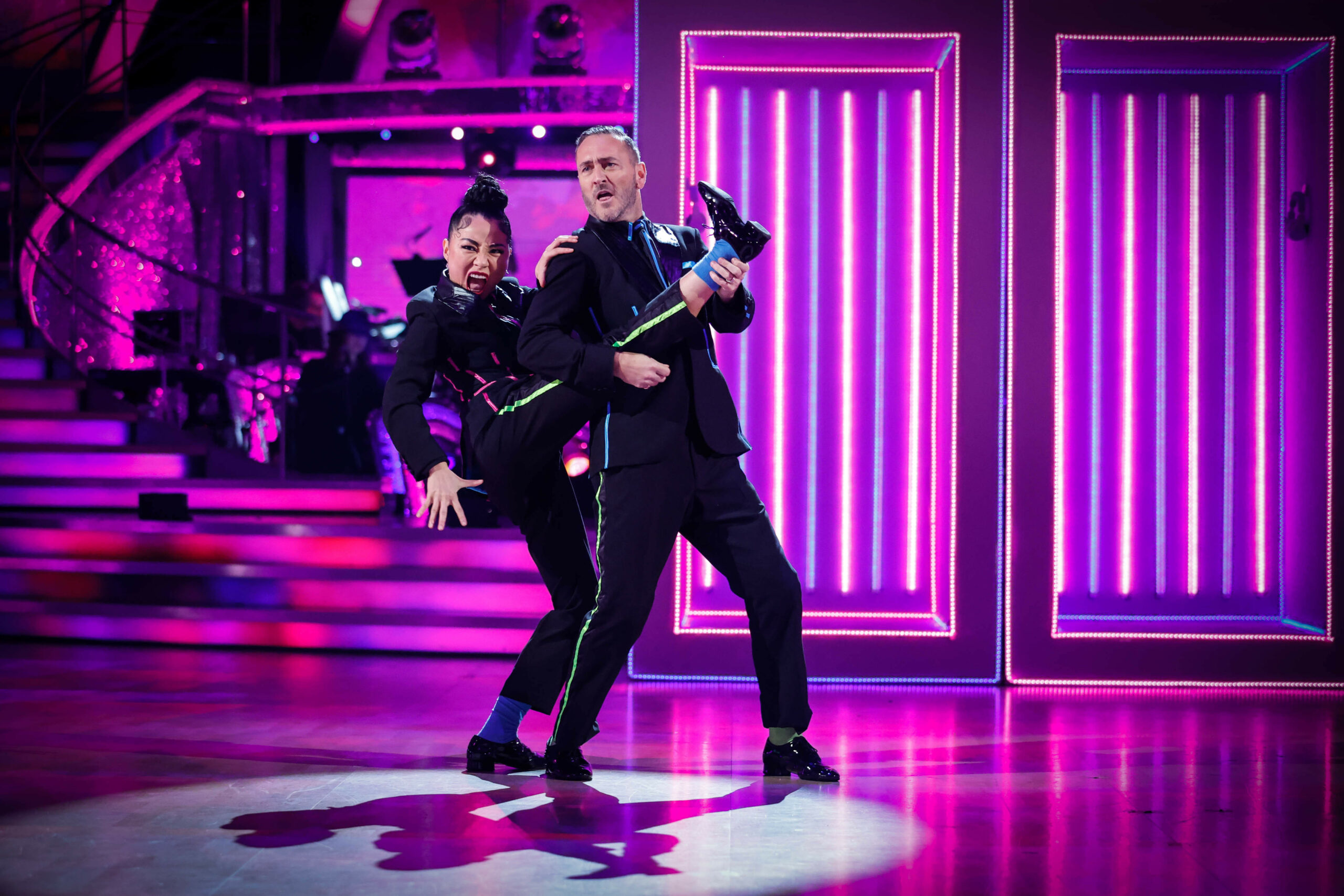 Will Mellor plays guitar on Nancy Xu's leg on Strictly