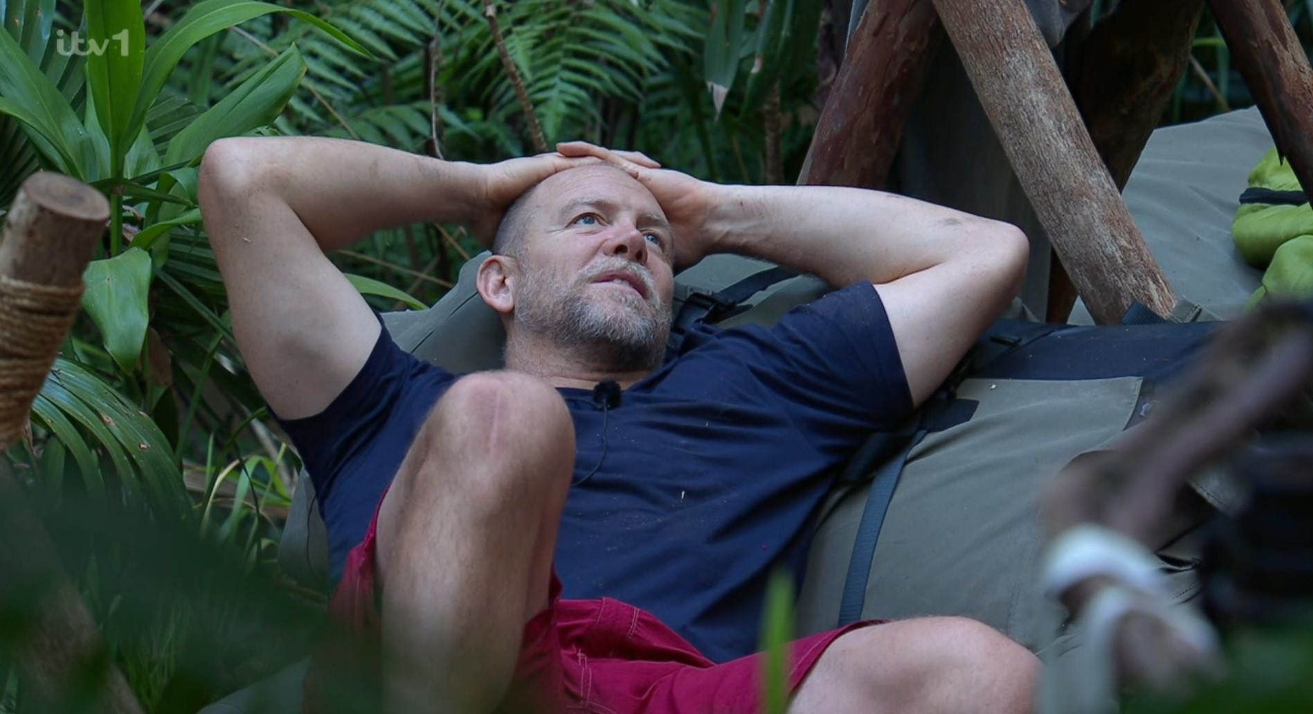 Mike Tindall relaxes with his hands above his head in a hammock on I'm A Celebrity